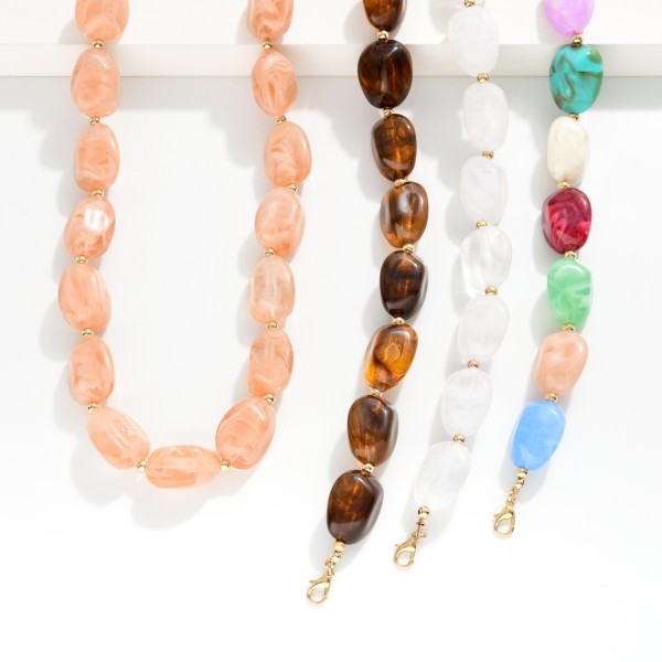 Marbled Acetate Beaded Necklace Featuring Gold Tone Beads 

- Approximately 16" L 
- Extender 3" L 