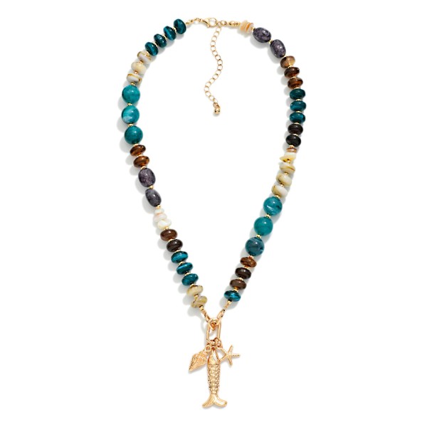 Marbled Acetate & Stone Beaded Necklace Featuring Metal Tone Fish & Shell Pendant 

- Approximately 16" L
- Extender 3" L
