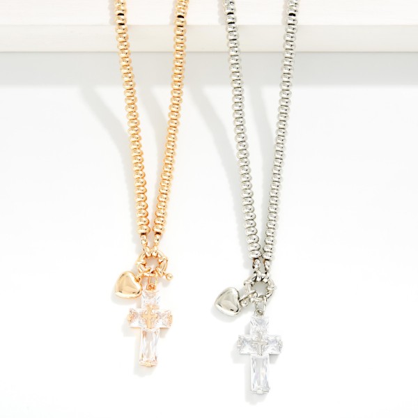 Metal Tone Beaded Necklace Featuring Crystal Heart Pendant 

- Approximately 16" L
- Extender 3" L