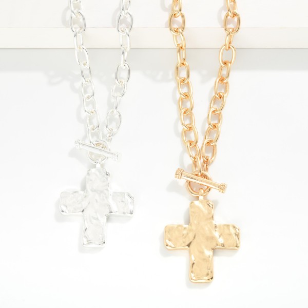 Metal Tone Chain Link Necklace Featuring Hammered Cross Pendant & Toggle Clasp 

- Approximately 20" L 
- Extender 3" L 
