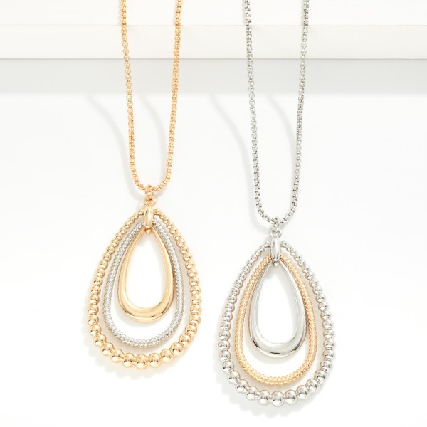 Long Chain Link Necklace Featuring Nesting Textured Metal Teardrops Pendant 

- Approximately 36" L
- Extender 3" L