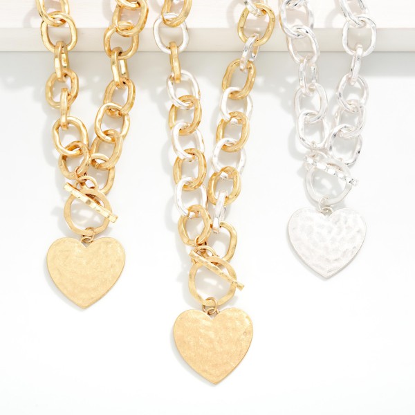 Hammered Metal Tone Chain Link Necklace Featuring Heart Pendant & Toggle Clasp 

- Approximately 16" L