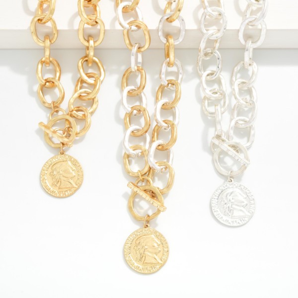 Hammered Metal Chain Link Necklace With Metal Tone Coin & Toggle Clasp

- Approximately 16" L