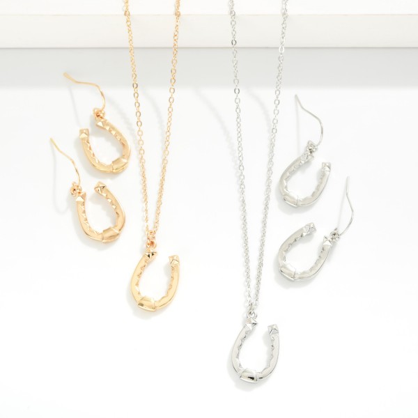 Chain Link Necklace Featuring Metal Tone Horseshoe Pendant 

- Horseshoe Drop Earrings Included 1" L
- Necklace Approximately 14" L
- Extender 3" L