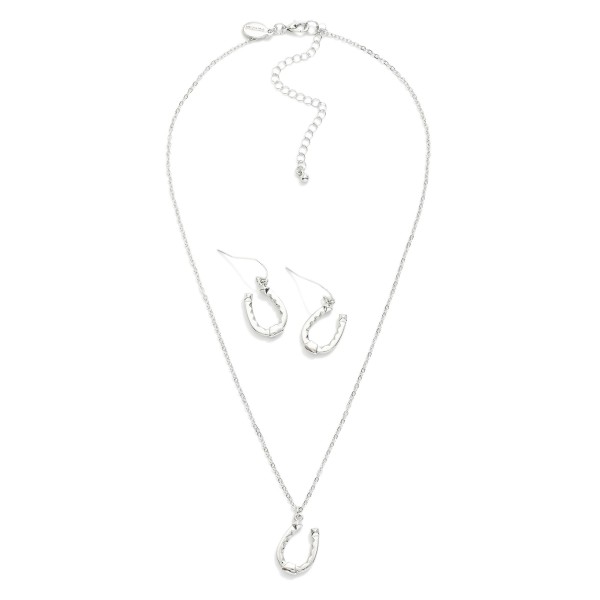 Chain Link Necklace Featuring Metal Tone Horseshoe Pendant 

- Horseshoe Drop Earrings Included 1" L
- Necklace Approximately 14" L
- Extender 3" L