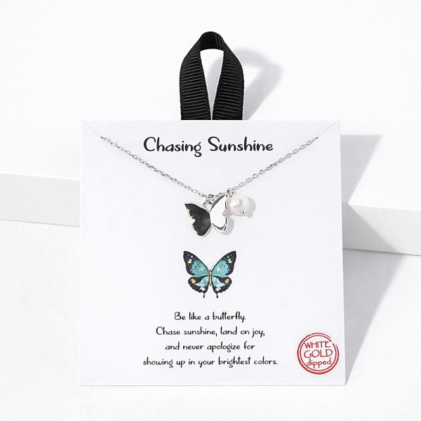 Dainty Chain Link Necklace Featuring Metal Tone Butterfly Pendant With Pearl  Accent																							
																									
- Approximately 16" L																									
- Extender 2" L																									
- Hypoallergenic Brass Base																									
- 18K Gold Dipped																									
- Card: "Be like a butterfly. Chase sunshine, land on joy, and never apologize for showing up in your brightest colors."																									
