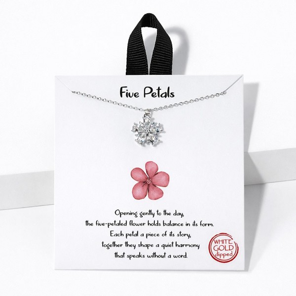 Dainty Chain Link Necklace Featuring Cubic Zirconia Flower Pendant 			
					
- Approximately 16" L					
- Extender 2" L					
- Hypoallergenic Brass Base					
- 18K Gold Dipped					
- Card: "Opening gently to the day, the five-petaled flower holds balance in its form. Each petal a piece of its story, together they shape a quiet harmony that speaks without a word."					