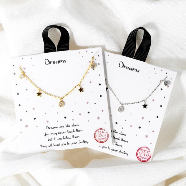 Dainty Chain Link Necklace Featuring Metal Tone Star & Cubic Zirconia Charms				
					
- Approximately 16" L					
- Extender 2" L					
- Hypoallergenic Brass Base					
- 18K Gold Dipped					
- Card: "Dreams are like stars. You may never touch them but if you follow them, they will lead you to your destiny."					