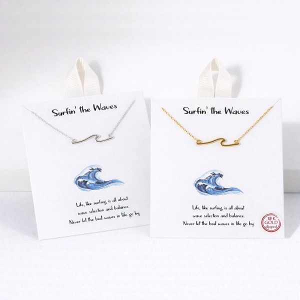 Dainty Chain Link Necklace Featuring Metal Tone Wave Pendant 				
					
- Approximately 16" L					
- Extender 2" L					
- Hypoallergenic Brass Base					
- 18K Gold Dipped					
- Card: "Life, like surfing is all about wave selection and balance. Never let the best waves in life go by."					