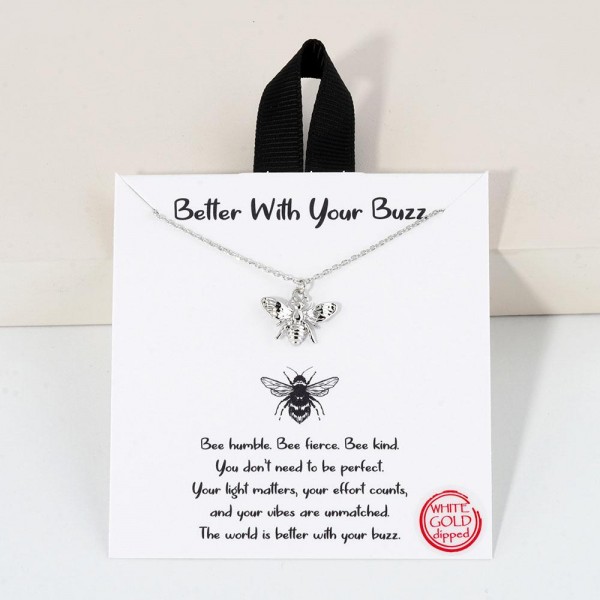 Dainty Chain Link Necklace Featuring Metal Tone Bee Pendant			
					
- Approximately 16" L					
- Extender 2" L					
- Hypoallergenic Brass Base					
- 18K Gold Dipped					
- Card: "Bee humble. Bee fierce. Bee kind. You don't need to be perfect. Your light matters, your effort counts, and your effort counts, and your vibes are unmated. The world is better with your buzz."					