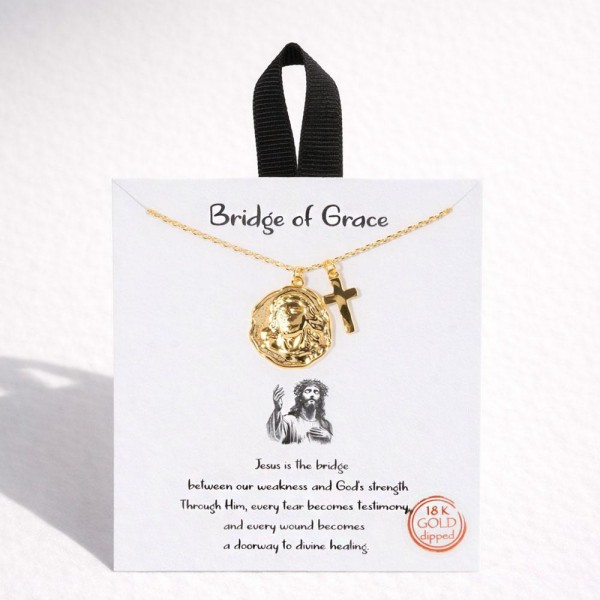 Dainty Chain Link Necklace Featuring Metal Tone Jesus Medallion & Cross Pendants 			
					
- Approximately 16" L					
- Extender 2" L					
- Hypoallergenic Brass Base					
- 18K Gold Dipped					
- Card: "Jesus is the bridge between our weakness and God's strength. Through Him, every tear becomes testimony, and every wound becomes a doorway to divine healing."					
					
