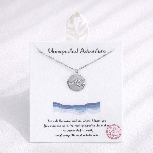 Dainty Chain Link Necklace Featuring Metal Tone Circle Wave Pendant 					
					
- Approximately 16" L					
- Extender 2" L					
- Hypoallergenic Brass Base					
- 18K Gold Dipped					
- Card: "Just ride the wave and see where it leads you. You may end up in the most unexpected destination. The unexpected is usually what brings the most unbelievable." 					