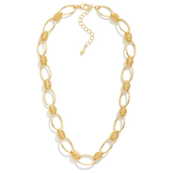 Oval Link Necklace Featuring Metal Spring Ball Stations 

- Approximately 16" L
- Extender 3" L 
