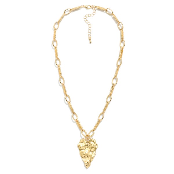 Textured Metal Link Chain Link Necklace With Hammered Metal Heart Pendant 

- Approximately 16" L
- Extender 3" L