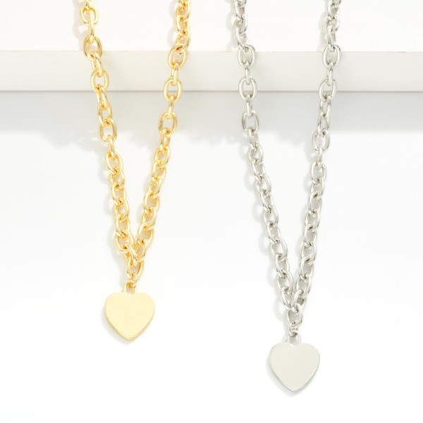 Chain Link Necklace Featuring Flat Metal Tone Heart Pendant 

- Gold Dipped
- Approximately 18" L
- Extender 1" L