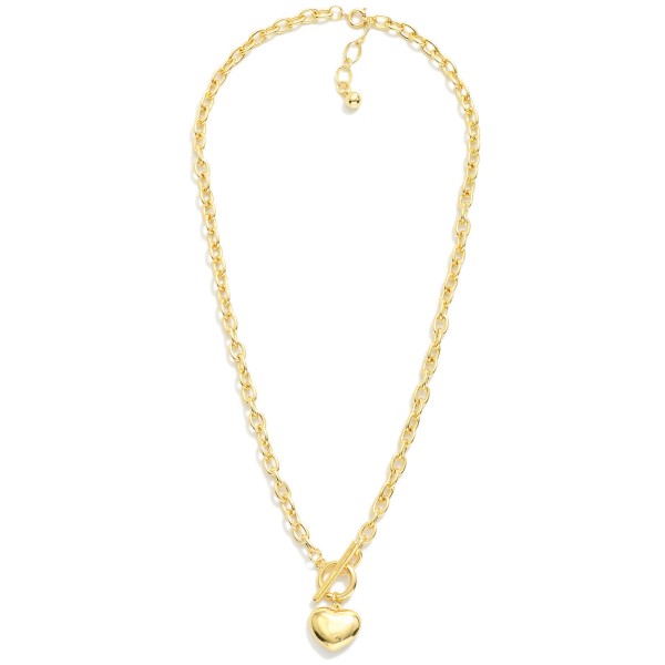 Chain Link Necklace Featuring Puffy Metal Tone Heart Pendant & Toggle Clasp 

- Gold Dipped
- Approximately 18" L
- Extender 1" L