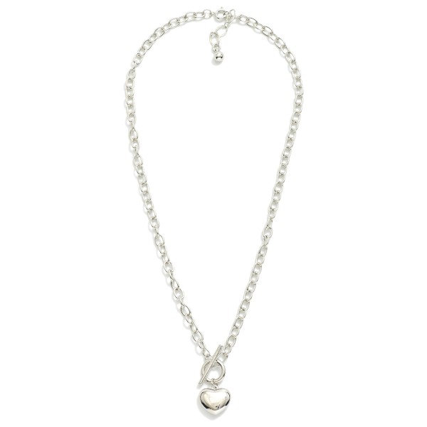 Chain Link Necklace Featuring Puffy Metal Tone Heart Pendant & Toggle Clasp 

- Gold Dipped
- Approximately 18" L
- Extender 1" L