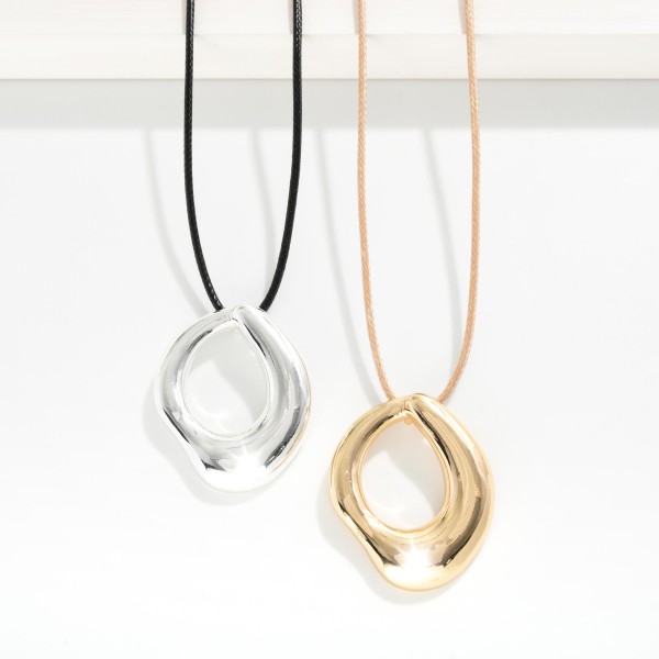 Wax Cord Necklace Featuring Hollow Metal Tone Geometric Shape Pendant 

- Approximately 16" L
- Extender 3" L