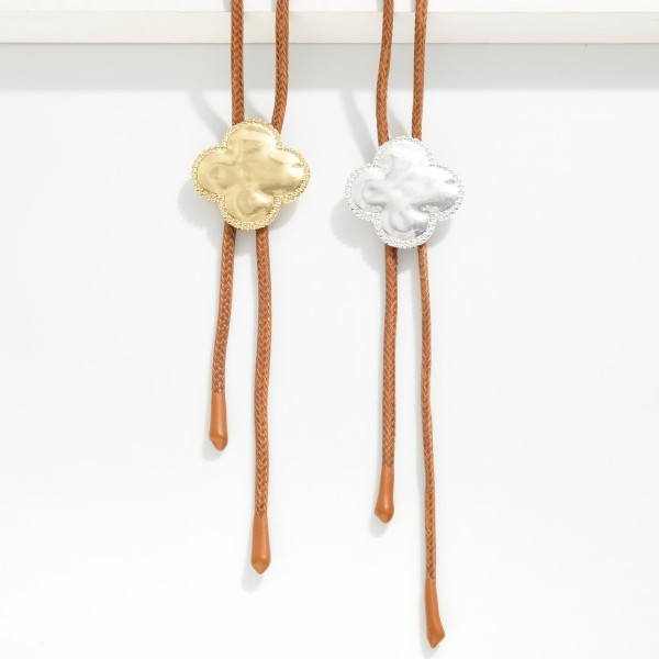 Leather Bolo Necklace Featuring Hammered Metal Clover Pendant

- Adjust To The Length Of Your Choosing
- Approximately 36" L

