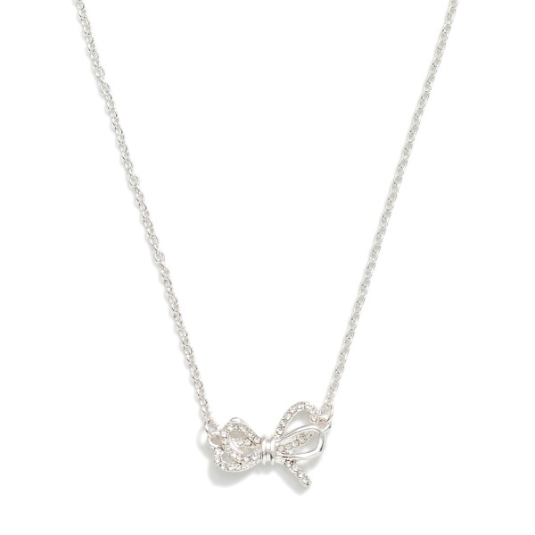 Dainty Chain Link Necklace Featuring Cubic Zirconia & Metal Tone Bow Pendant

- Approximately 15" L
- Extender 2" L

