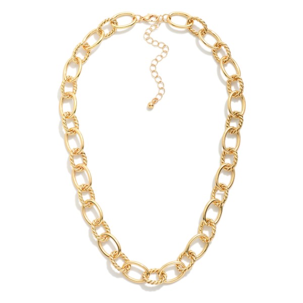 Metal Tone Oval Chain Link Necklace Featuring Textured Ovals 

- Approximately 14" L
- Extender 2" L


