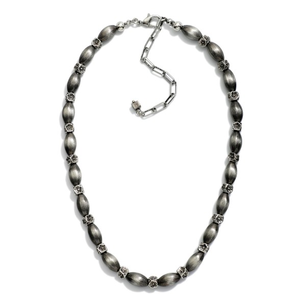 Brushed Metal Cylinder Bead & Metal Flower Beaded Necklace 

- Approximately 14" L
- Extender 3" L