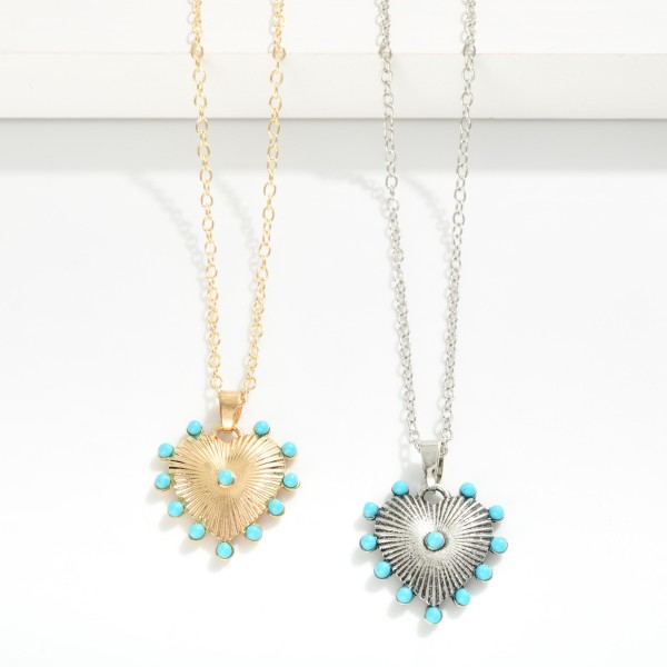 Chain Link Necklace Featuring Ribbed Metal Tone Heart Pendant With Turquoise Stud Details 

- Approximately 14" L
- Extender 3" L