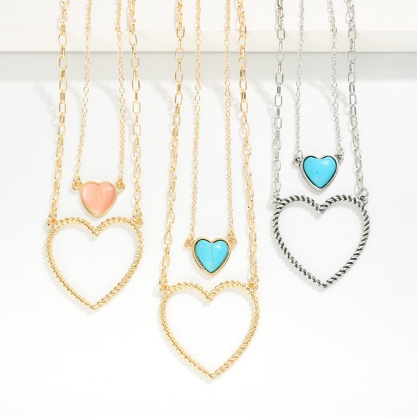 Layered Chain Link Necklace Featuring Stone Heart & Twisted Metal Heart Pendants 

- Approximately 14" L
- Extender 3" L