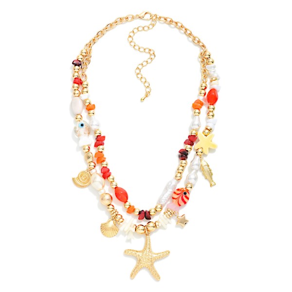 Layered Beaded Necklace Featuring Flash Fish, Pearls, & Metal Tone Beach Charms 

- Approximately 16" L
- Extender 3" L