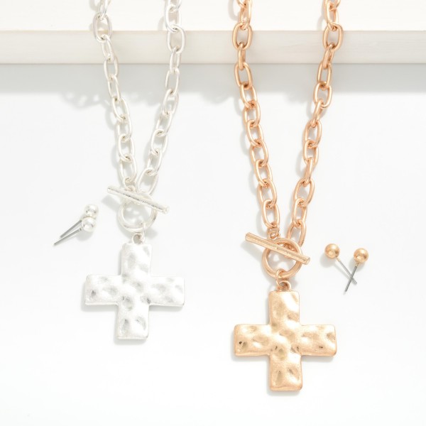 Chain Link Necklace Featuring Hammered Plus Cross Pendant & Toggle Clasp 

- Metal Tone Ball Stud Earrings Included
- Approximately 16" L
