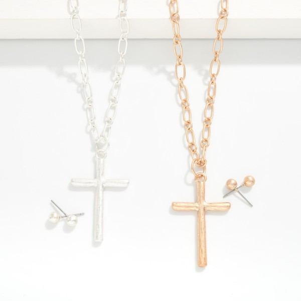 Paperclip Chain Link Necklace Featuring Metal Tone Cross Pendant With Metal Tone Stud Earrings 

- Approximately 20" L 
- Extender 2" L 
- Metal Tone Ball Studs Included 