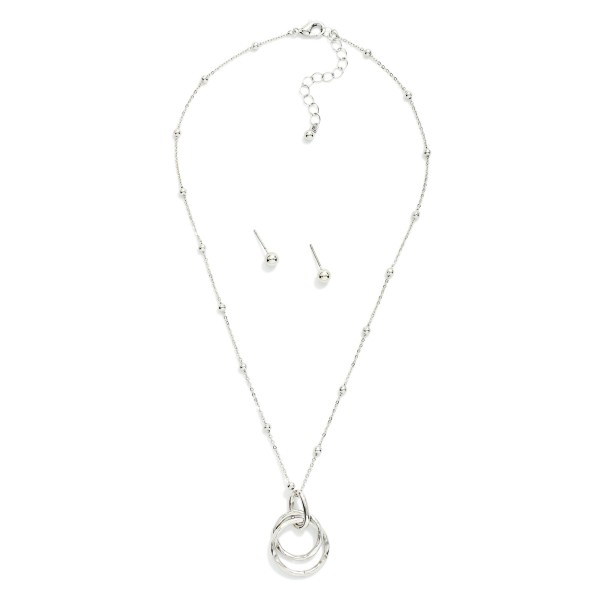 Chain Link Necklace With Metal Tone Ball Stations & Nesting Metal Tone Hoops Pendant 

- Metal Tone Ball Studs Included 
- Approximately 14" L
- Extender 3" L