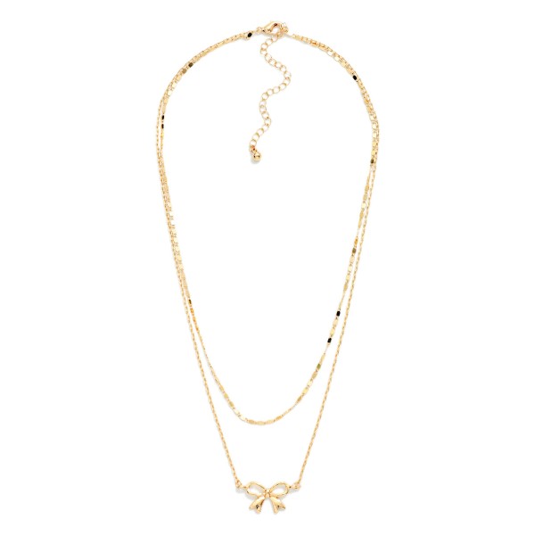 Layered Chain Link Necklace Featuring Metal Tone Bow Pendant 

- Approximately 14" L
- Extender 3" L
