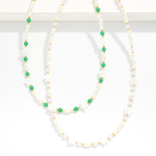 Pearl & Faceted Bead Beaded Necklace Featuring Pearl Star Stations 

- Approximately 14" L
- Extender 3" L