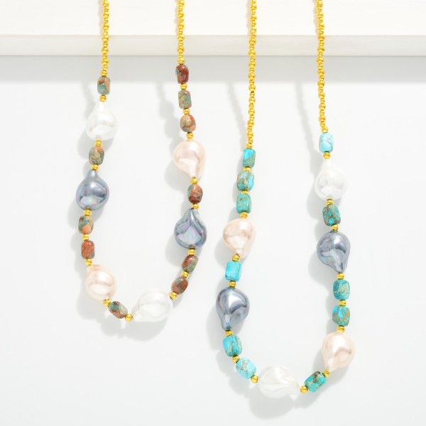 Beaded Necklace Featuring Metal Gold Tones, Baroque Pearls, And Stones

- Approximately 14" L 
- Extender 3" L 