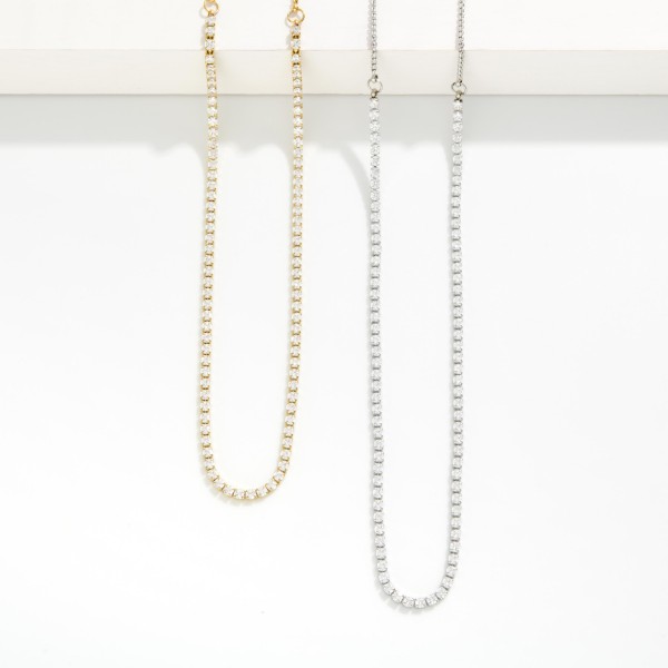 Adjustable Chain Link Cubic Zirconia Tennis Necklace 

- Approximately 17" L 
- Extender 3"L 
- Stainless Steel 
- Water Resistant 