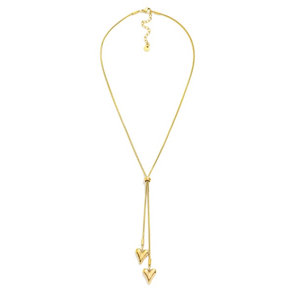 Snake Chain Bolo Style Necklace Featuring Heart Pendents 

- Approximately 22" L 
- Stainless Steal
- Water Resistant
