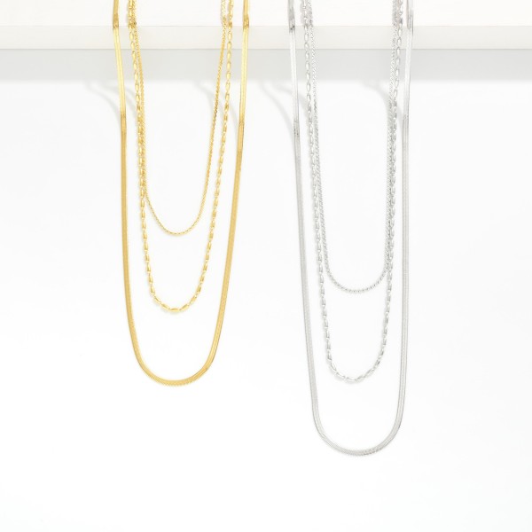 Layered Multi Chain Link Necklace 

- Approximately 16" L 
- Extender 3"L 
- Stainless Steel 
- Water Resistant 