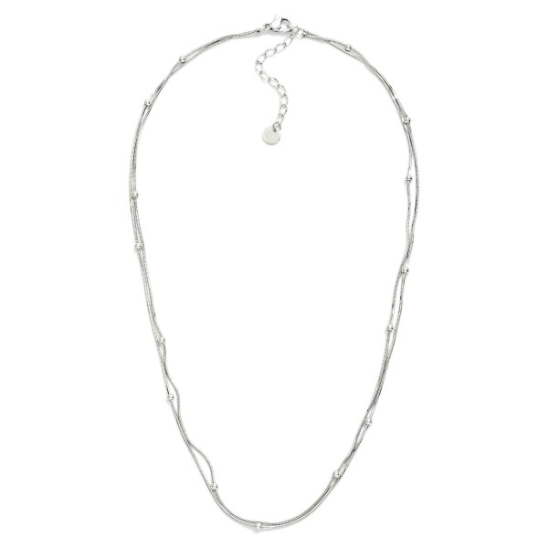 Layered Snake Chain Necklace Featuring Metal Ball Stations 

- Approximately 15" L 
- Extender 3"L 
- Stainless Steel 
- Water Resistant 