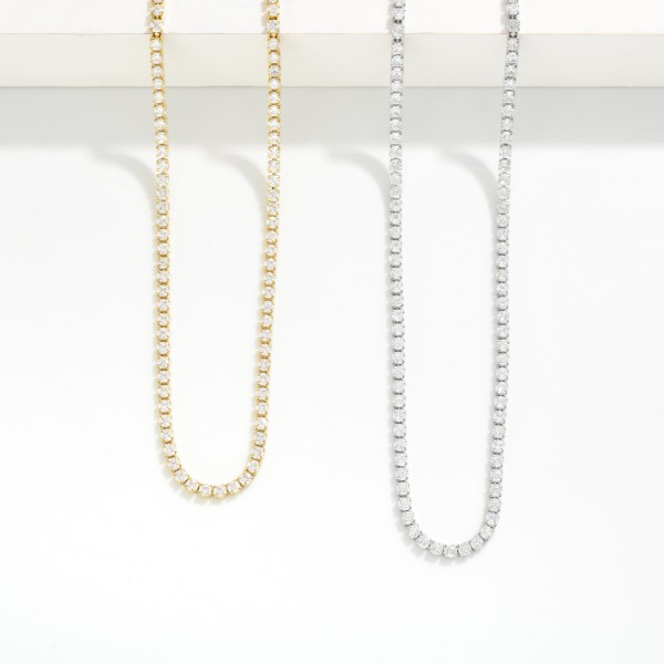 Metal Tone Chain link Rhinestone Tennis Necklace

- Approximately 12"L 
- Extender 2" L 
- Stainless Steal 
- Water Resistant 