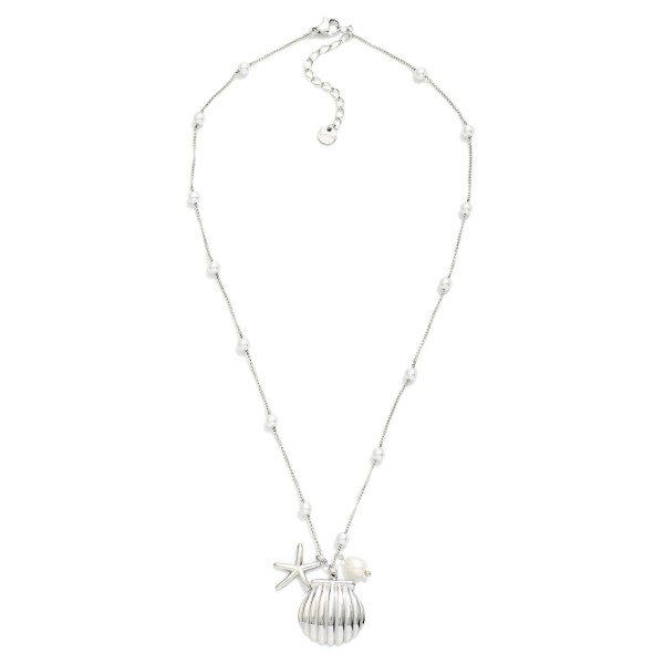 Metal Tone Chain Link Necklace Featuring Pearl Stations & Shell Pendant 

- Approximately 16" L 
- Stainless Steal
- Water Resistant
