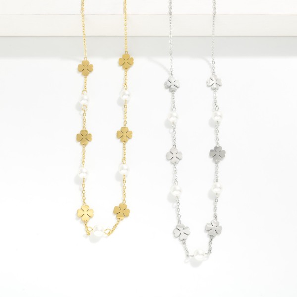 Chain Link Necklace Featuring Metal Four Leaf Clover And Pearl Stations 

- Approximately 14" L 
- Extender 3"L 
- Stainless Steel 
- Water Resistant 