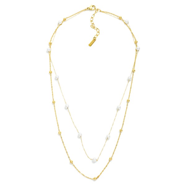 Layered Dainty Chain Link Necklace Featuring Metal Ball And Pearl Stations 

- Approximately 14" L 
- Extender 3"L 
- Stainless Steel 
- Water Resistant 