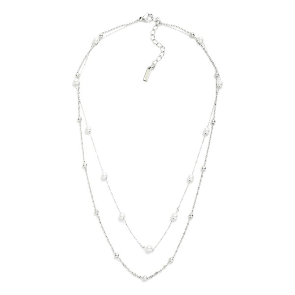 Layered Dainty Chain Link Necklace Featuring Metal Ball And Pearl Stations 

- Approximately 14" L 
- Extender 3"L 
- Stainless Steel 
- Water Resistant 