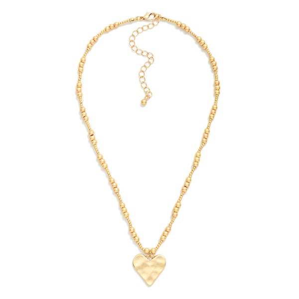 Metal Tone Metallic Beaded Necklace Featuring Hammered Heart Pendant 

- Approximately 16" L
- Extender 2" L 