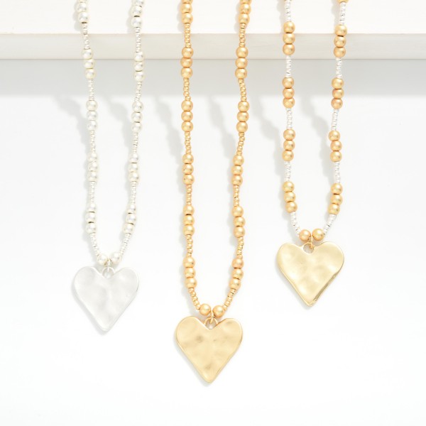 Metal Tone Metallic Beaded Necklace Featuring Hammered Heart Pendant 

- Approximately 16" L
- Extender 2" L 
