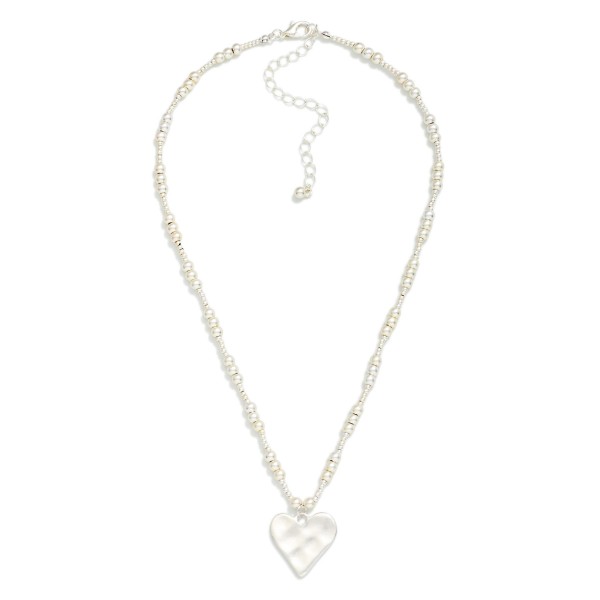 Metal Tone Metallic Beaded Necklace Featuring Hammered Heart Pendant 

- Approximately 16" L
- Extender 2" L 