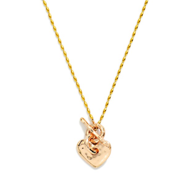 Metal Tone Oval Bead Beaded Necklace Featuring Hammered Metal Heart & Toggle Clasp

- Approximately 14" L