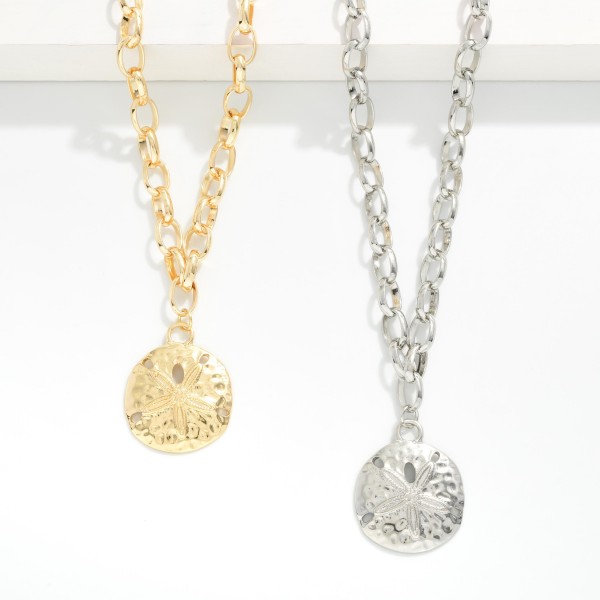 Chain Link Necklace Featuring Metal Tone Sand Dollar Pendant 

- Approximately 16" L
- Extender 3" L
