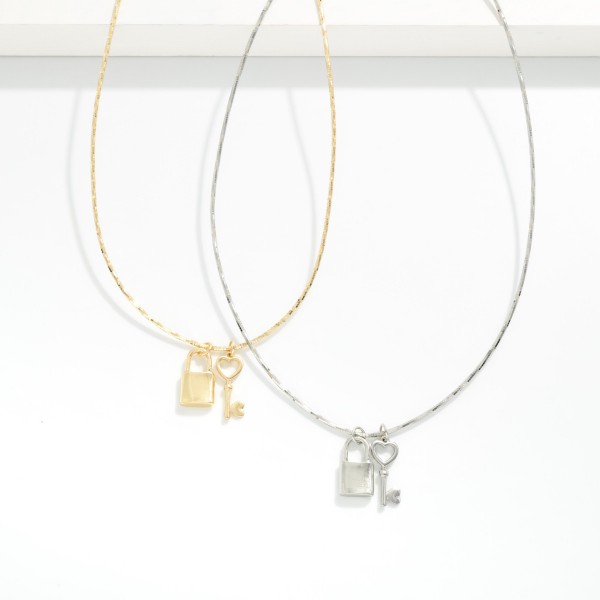 Stiff Chain Link Necklace Featuring Metal Tone Lock & Key Pendant 

- Approximately 16" L
- Extender 3" L